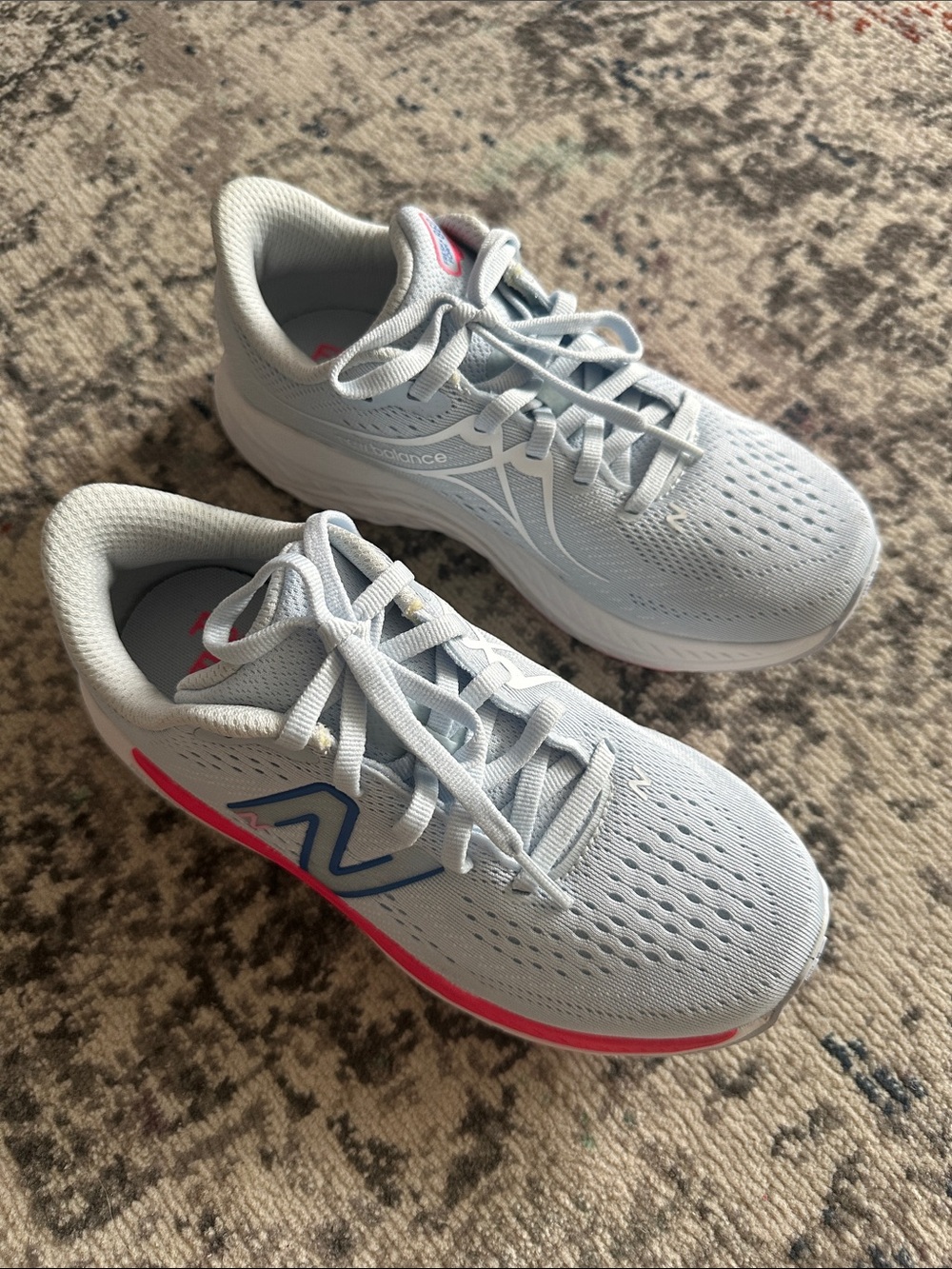 New Balance Kids Light Blue Sneakers with Pink and Blue Accents